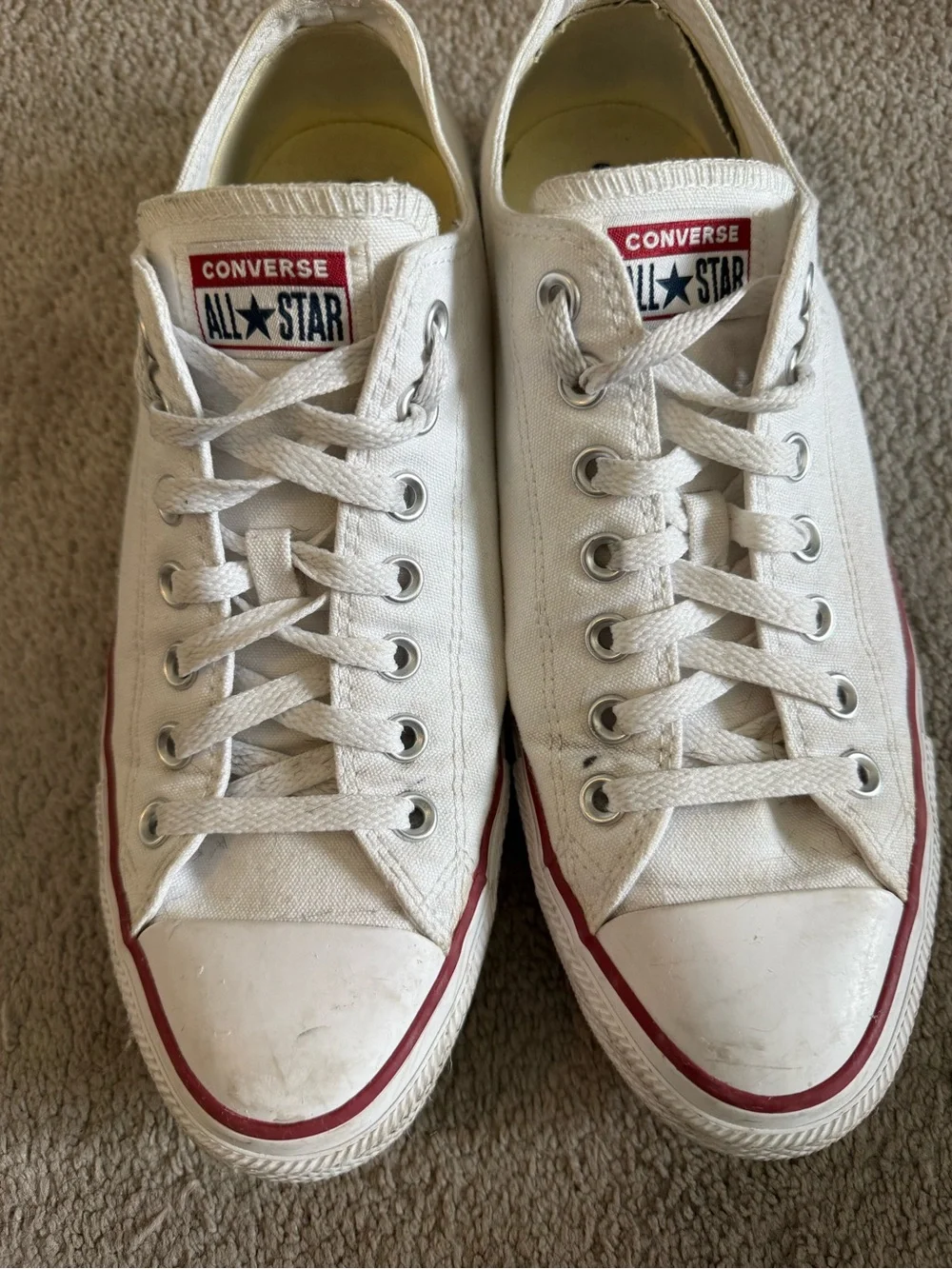 Converse Low Top Sneakers in White with Red Trim